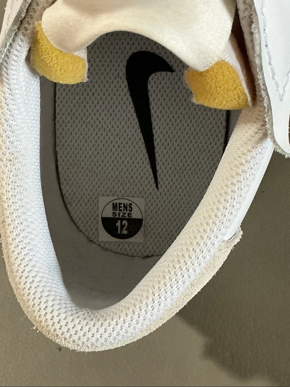 Nike White Low-Top Sneakers with Black Swoosh and Neon Yellow Accents